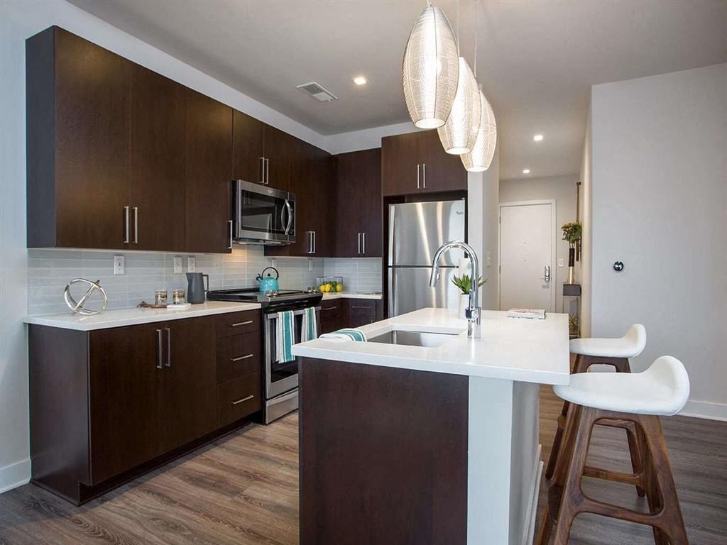a kitchen with a sink and a counter top