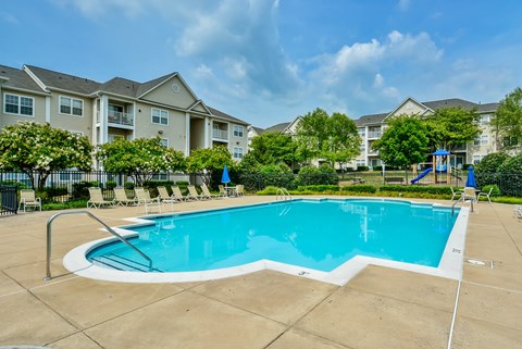 Resort style swimming pool with sundeck at Potomac Station Apartments, Virginia, 20176