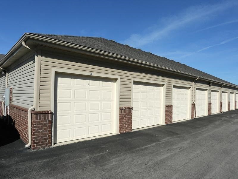a row of garage doors on the side of a building