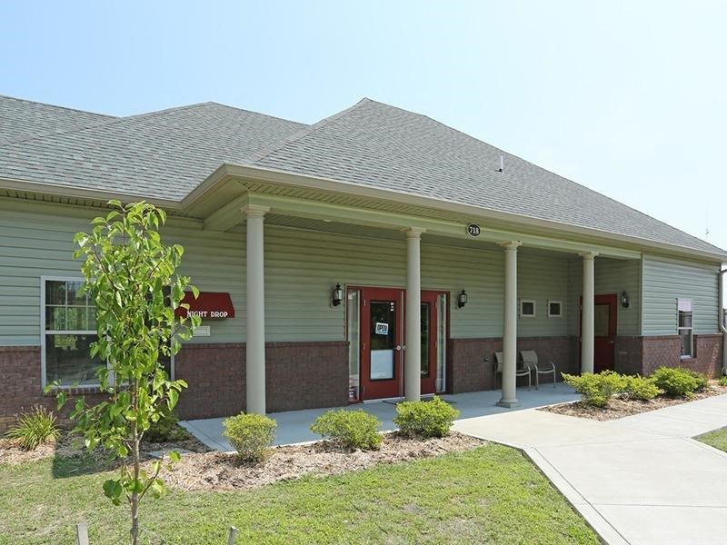 a building with a porch and a front door
