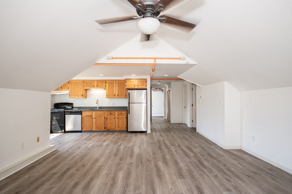 a kitchen and living room in an attic