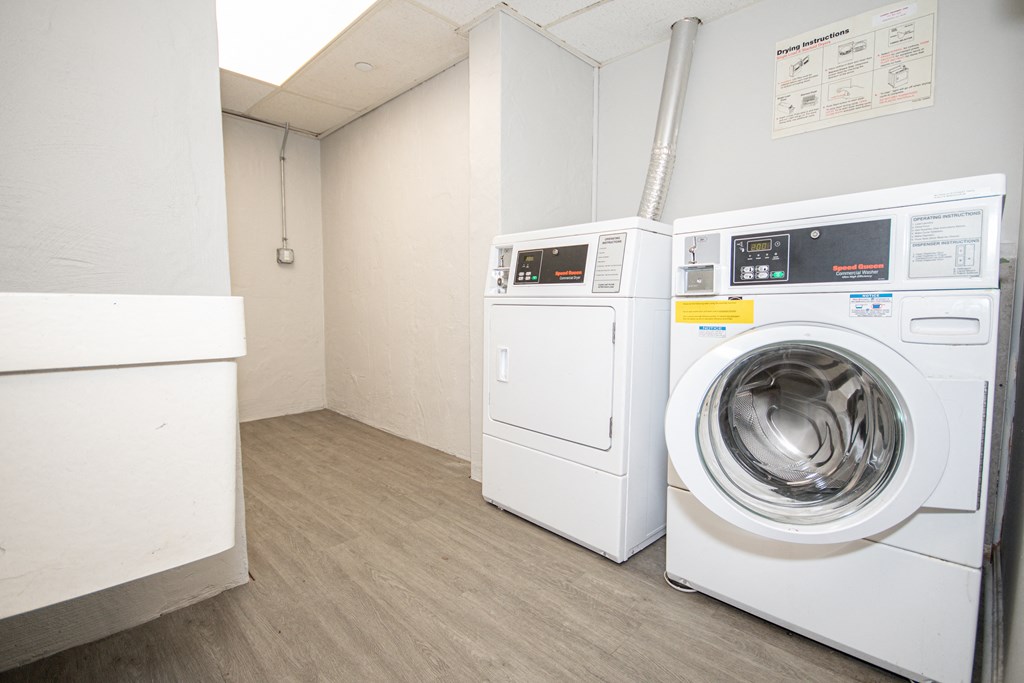 a laundry room with a washer and dryer