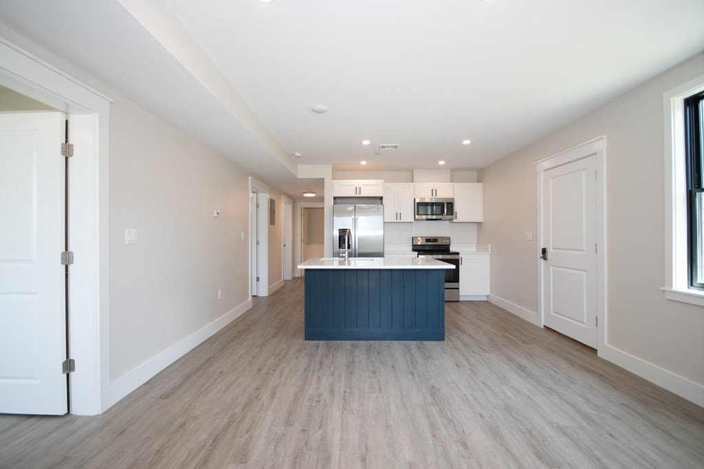 a kitchen and dining area in a 555 waverly unit