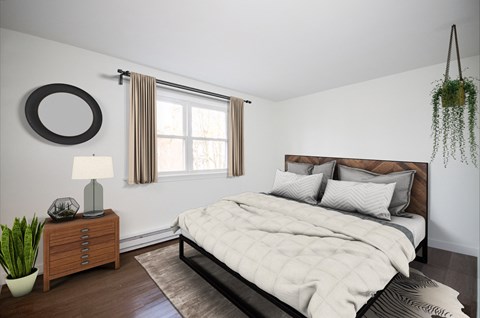 a bedroom with a bed and a dresser and a window