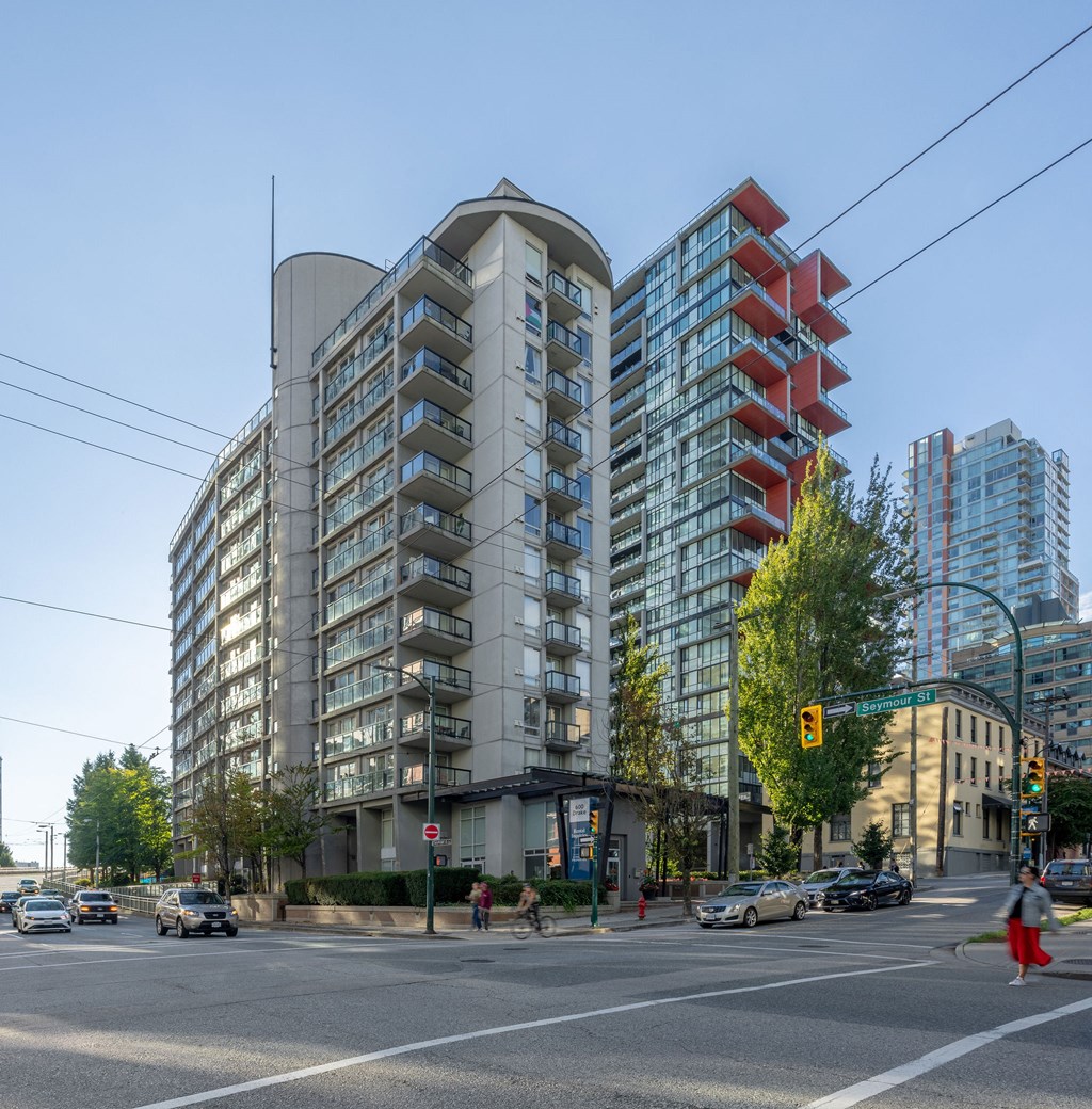 a city street with tall buildings and cars on it