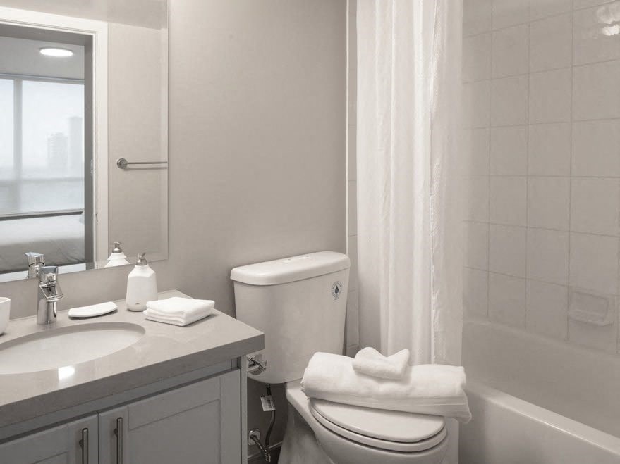 a bathroom with a toilet sink and bathtub