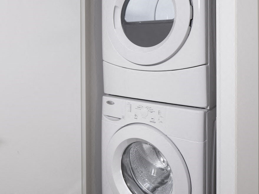 a front loading washer and dryer in a bathroom
