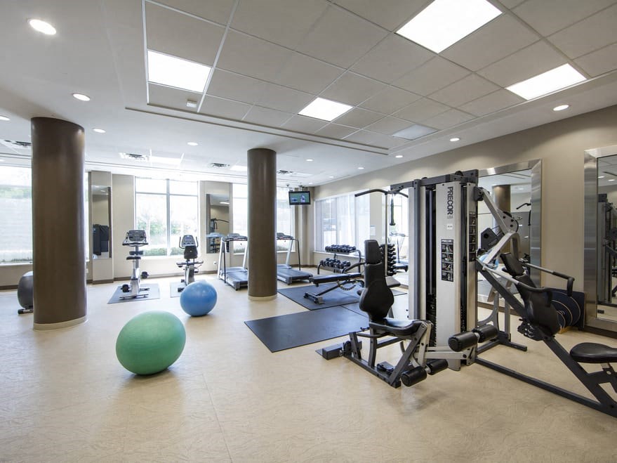 a workout room with weights and other exercise equipment at the m on hennepin apartments