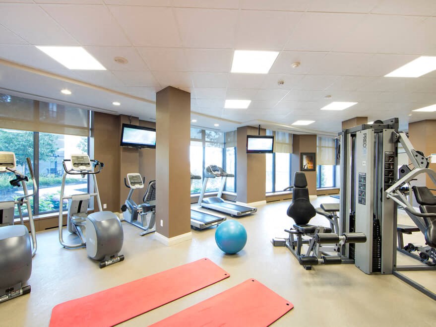a room filled with lots of different types of exercise equipment