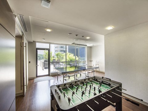 a room with a foosball table and a ping pong table