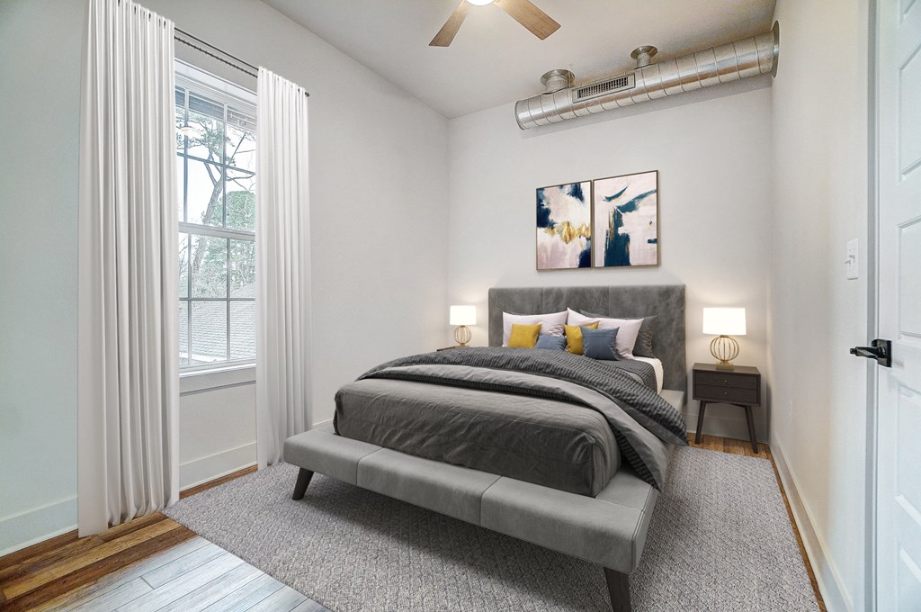 a bedroom with a bed and a window