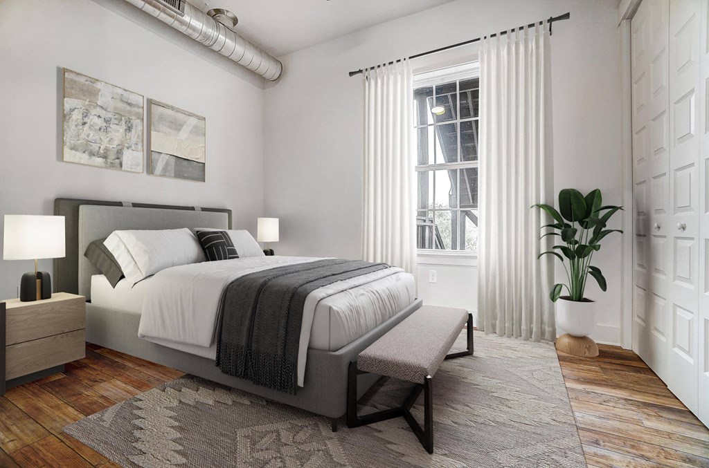 a bedroom with a bed and a window