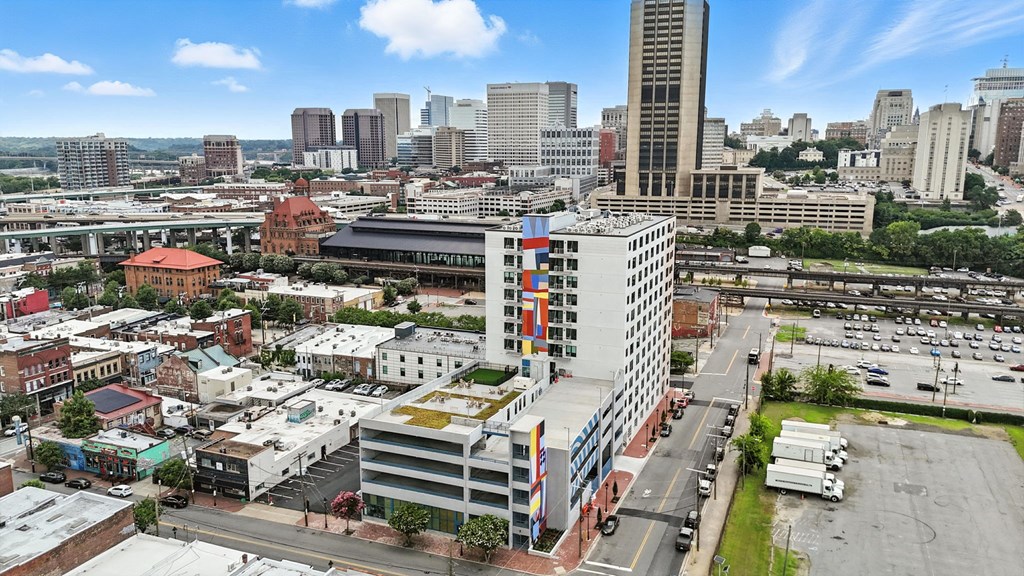 A cityscape with a mix of modern and older buildings.