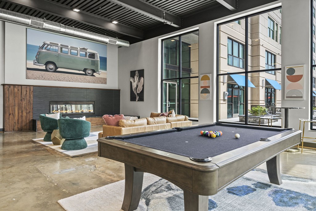 a pool table in the clubhouse at the bradley braddock road station apartments at The Icon, Richmond, VA 23230