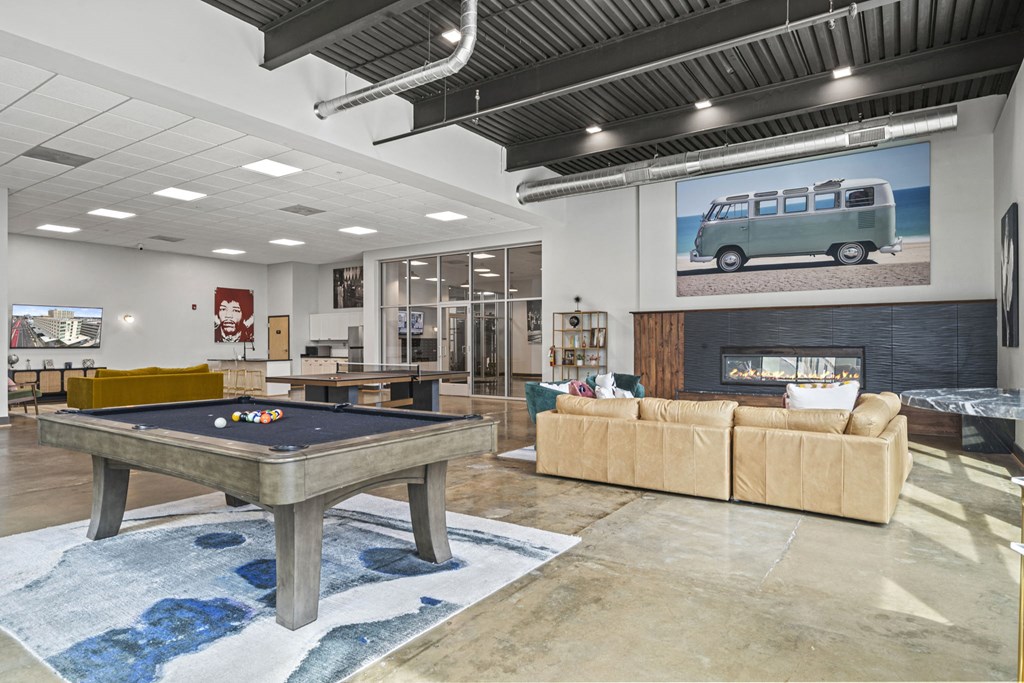 a games room with a pool table and couches at The Icon, Richmond, VA 23230