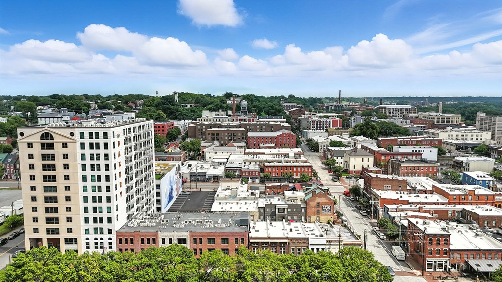 A cityscape with buildings of various sizes and a clear sky.