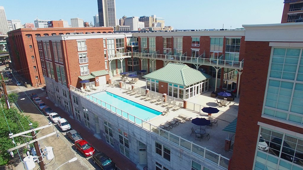 a building with a swimming pool on the top of it