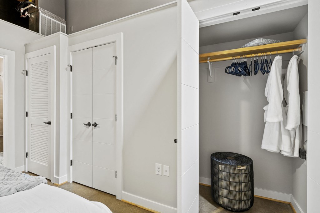 a bedroom with a bed and a closet