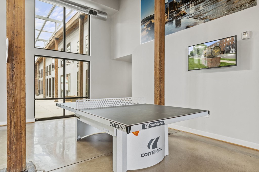 a ping pong table in a white room