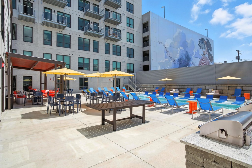 A large mural of a woman is on the side of a building.