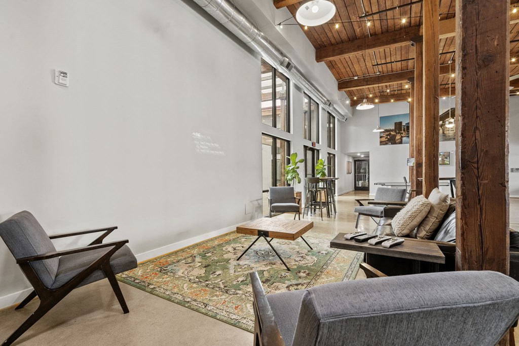 a living room filled with furniture and a large window