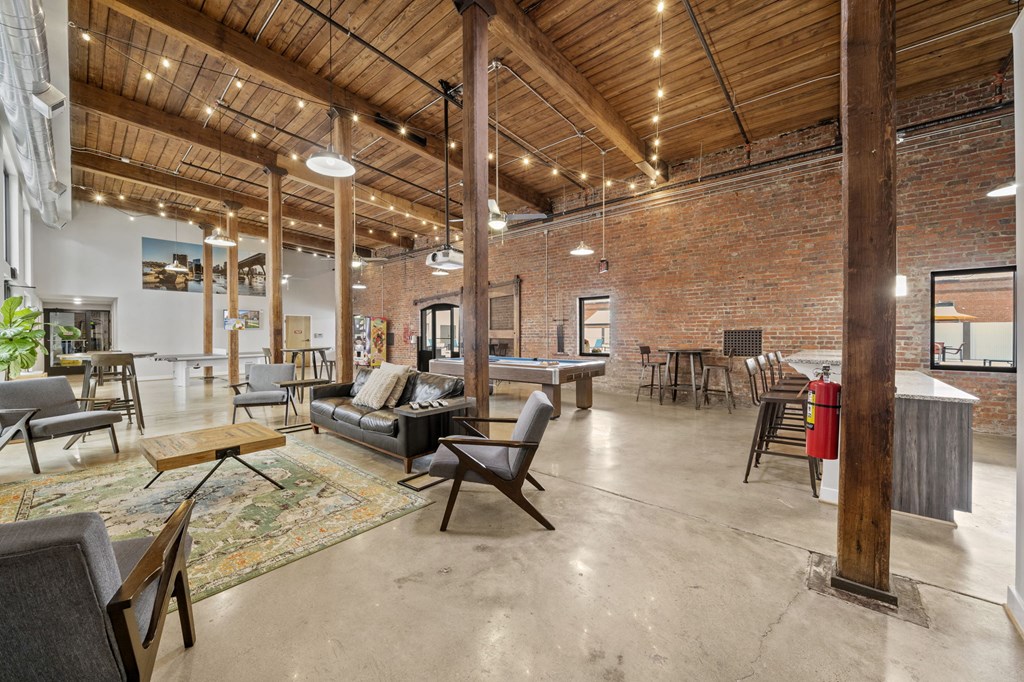 an open floor plan with a pool table and lounge area