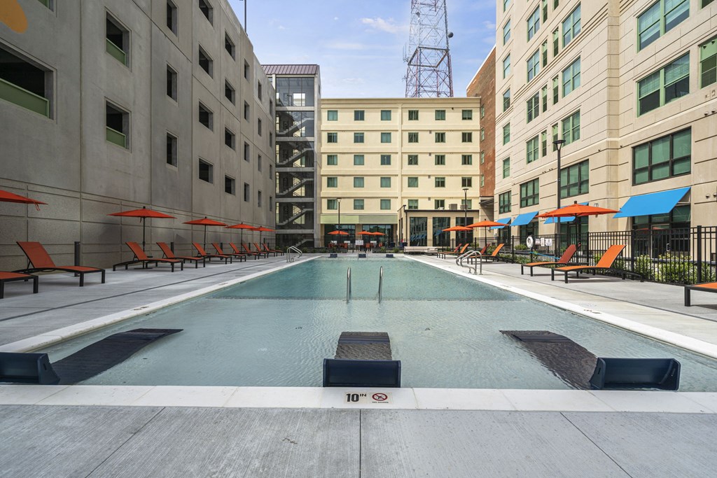 a swimming pool in the middle of two buildings  at The Icon, Richmond, VA 23230