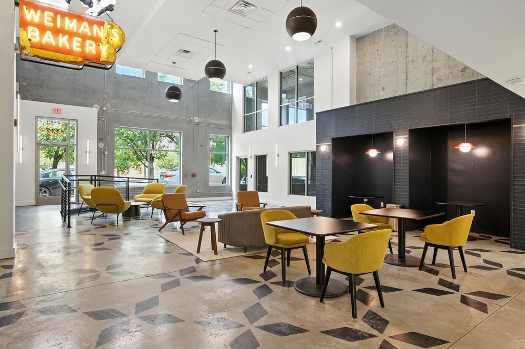 A Weiman's Bakery sign hangs over a dining area.
