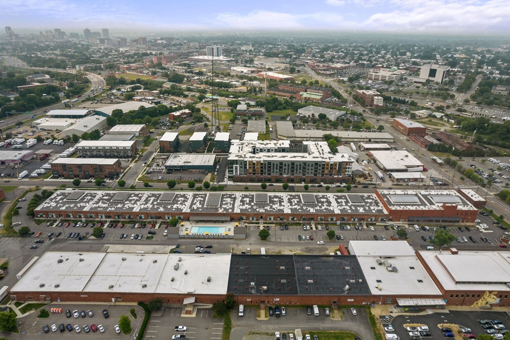 an aerial view of a large industrial area with several buildings and parking lots