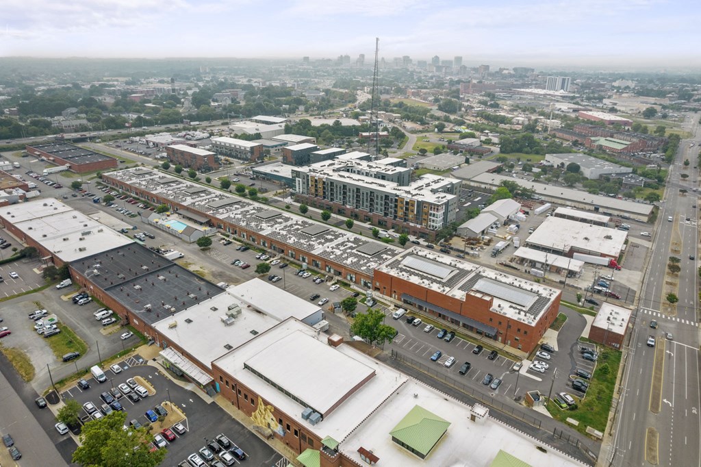 a view from the top of a building of a city with a city in the background