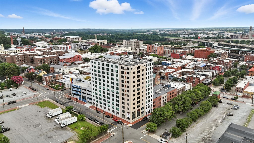 A cityscape with a large white building in the center.