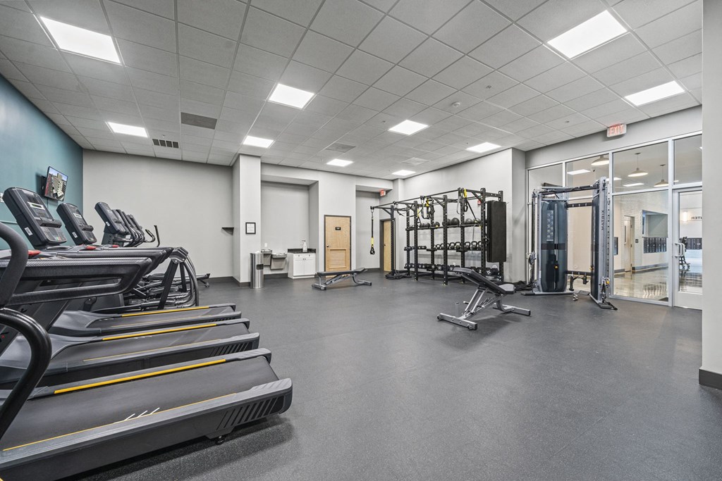 a large fitness room with treadmills and other exercise equipment  at The Icon, Richmond, VA, 23230