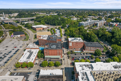 an aerial view of a city with buildings and trees