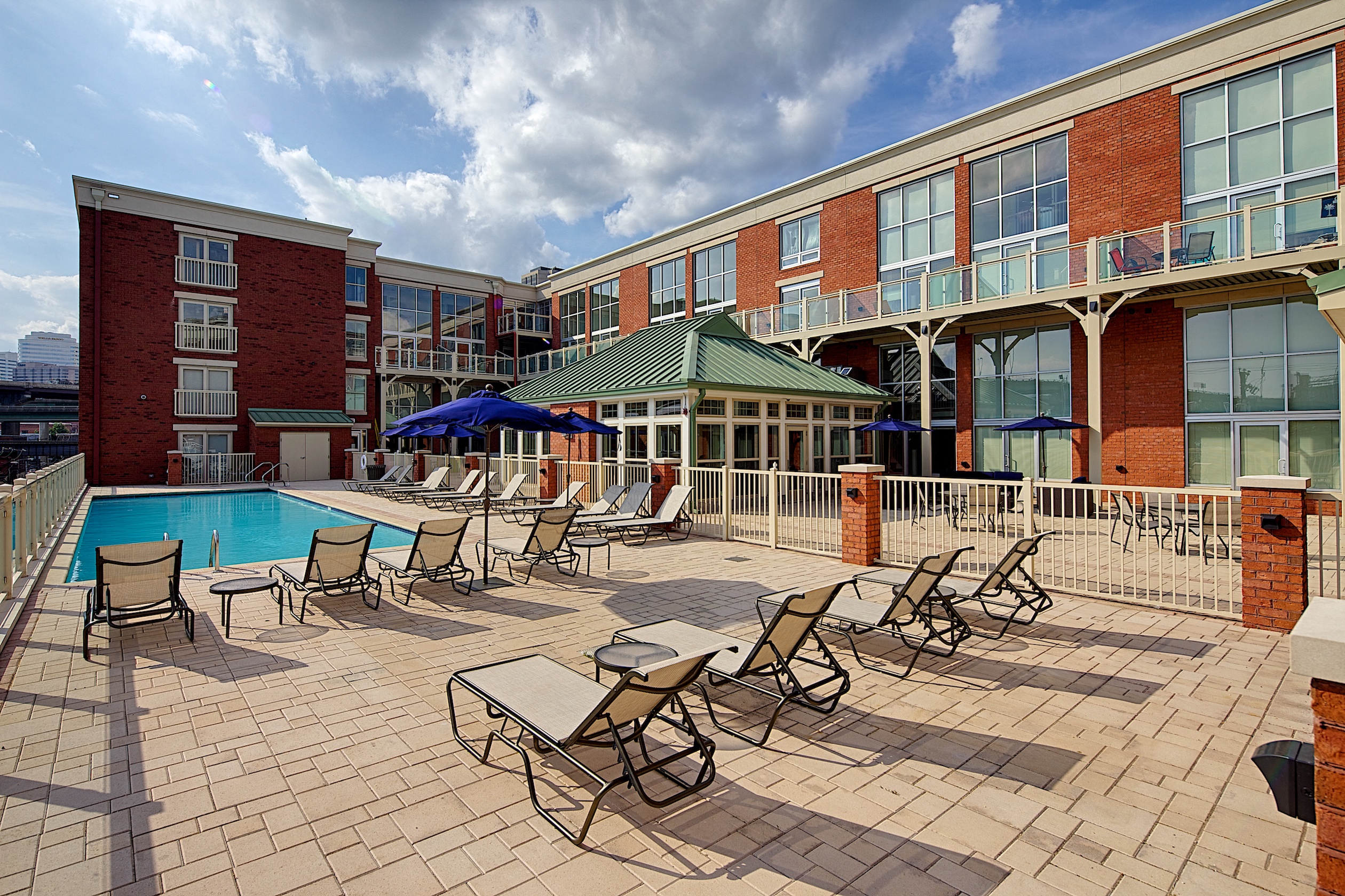 our apartments offer a pool and patio area with furniture