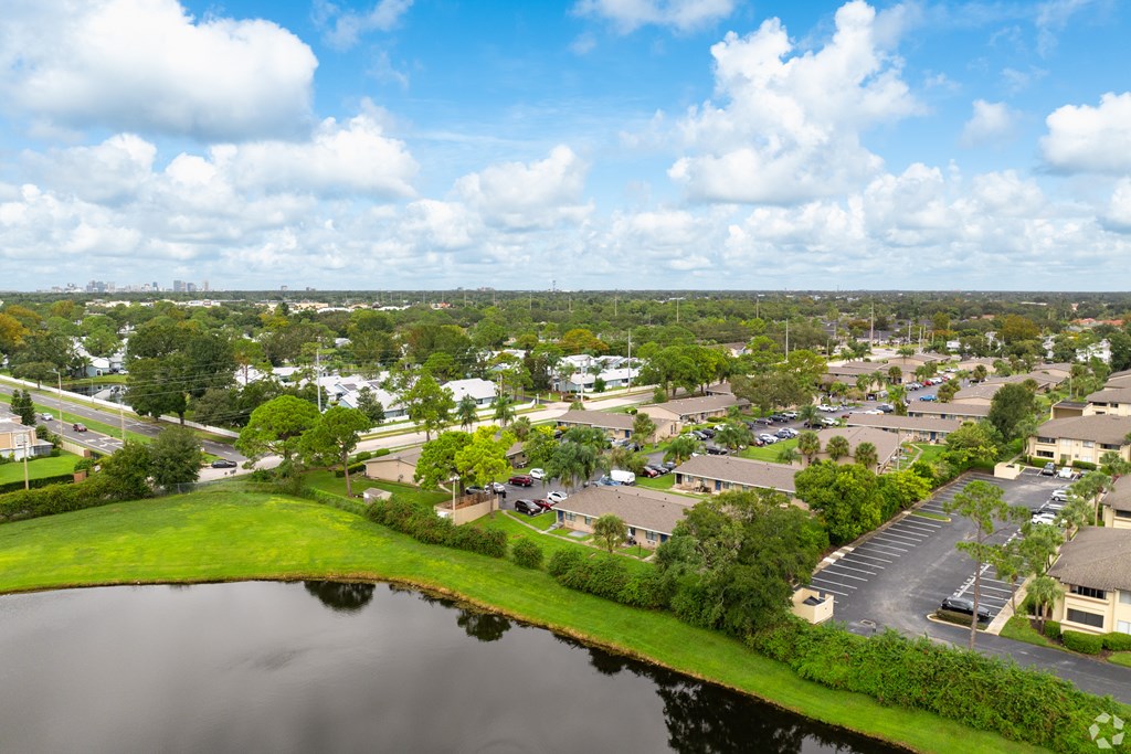 A lake in front of a residential area.