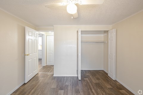 A room with a white door and a white wall.