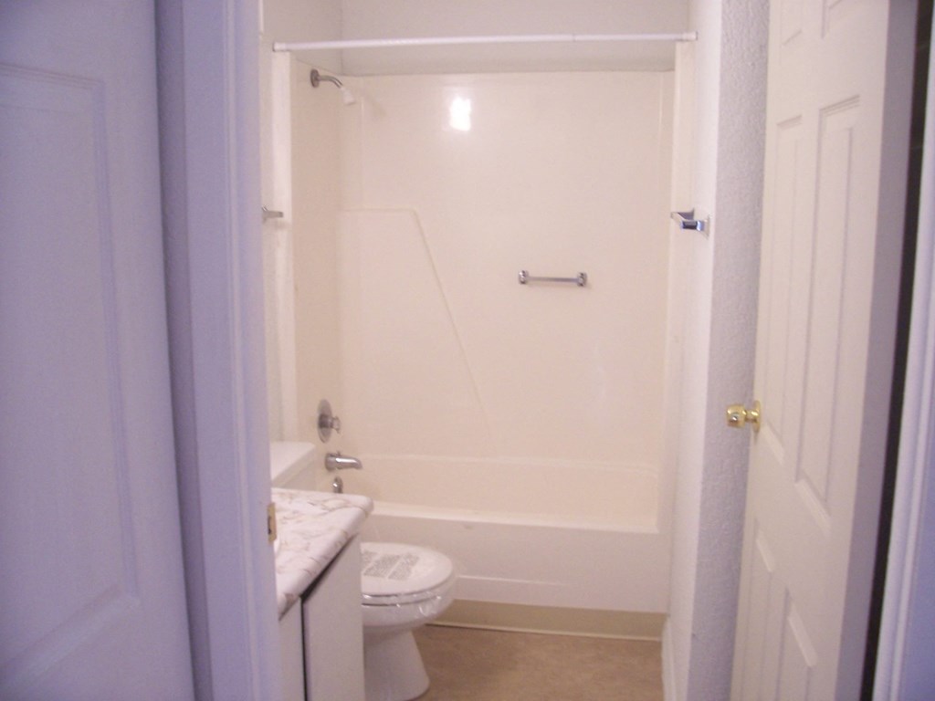 a small bathroom with a toilet and a shower