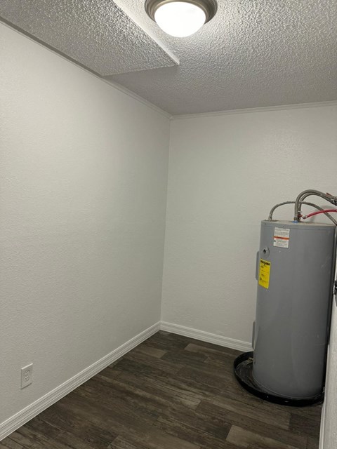 the interior of a room with a water heater