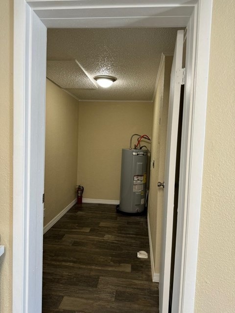 an empty room with a heater in it