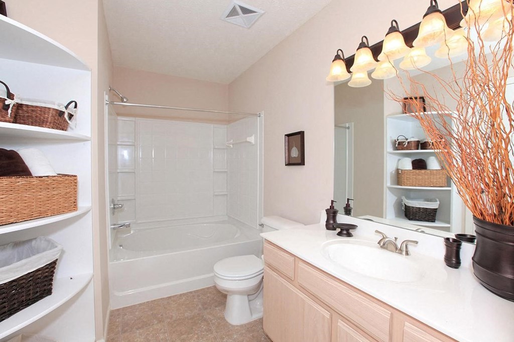 a bathroom with a sink toilet and a shower