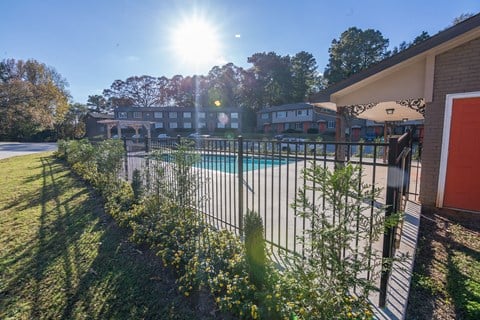 a pool with a fence in front of a building at Broadway at East Atlanta, Atlanta, Georgia