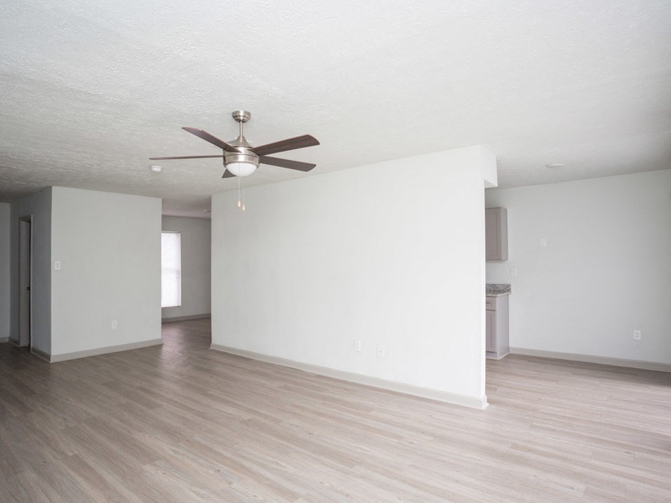 Unfurnished Living Room with ceiling fan and light at Gardens at Camp Creek, Atlanta, GA,30349
