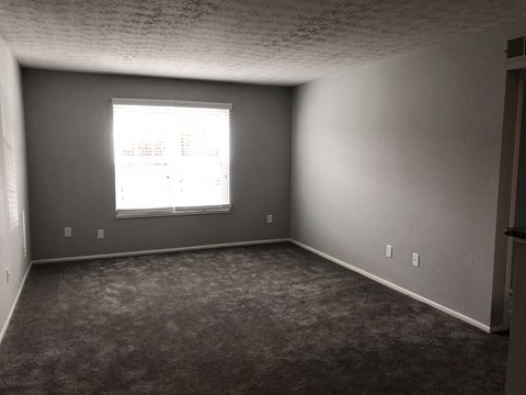 a room with gray walls and a window