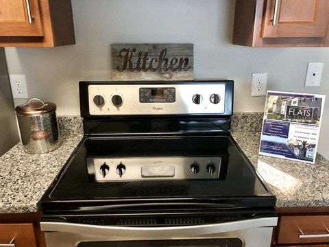 a kitchen with a stove and a counter top