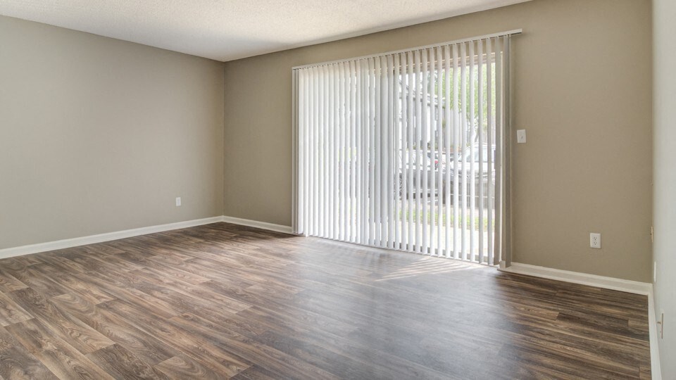 Vacant Living Room with Large Windows at The Benton Apartment Homes, Hoover, Alabama