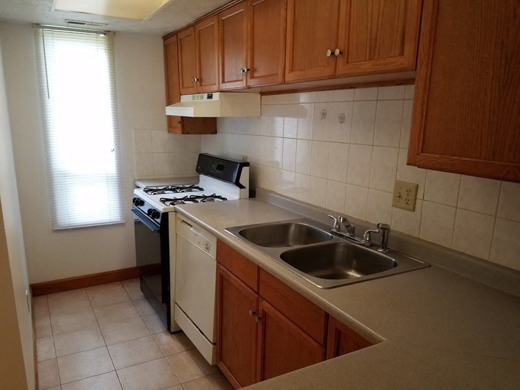a small kitchen with a sink and a stove