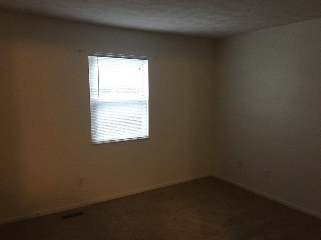 an empty room with a window in it