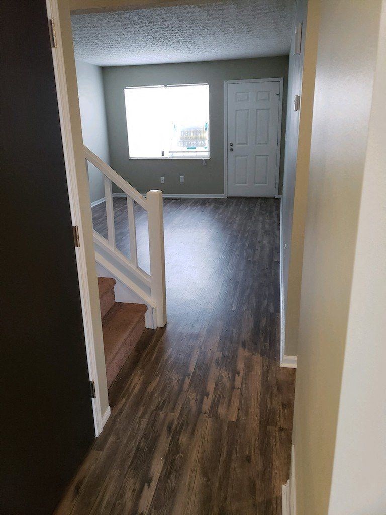 a view of a house from the bottom of the stairs