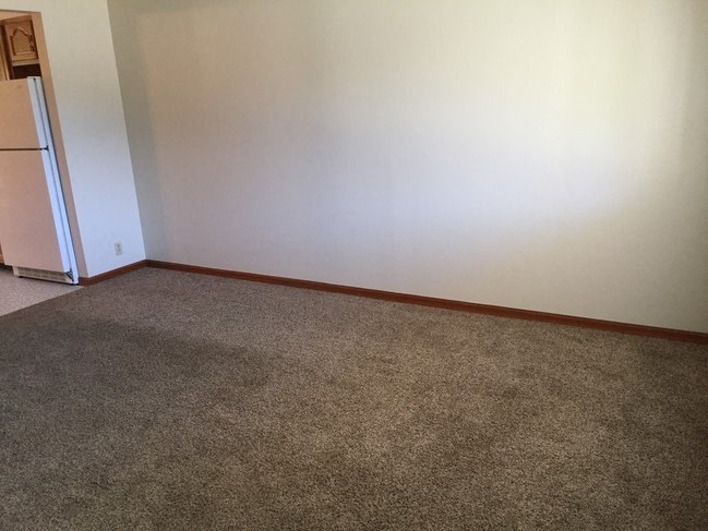 Bedroom with wooden flooring and window at Dutch Hills Terrace Apartments, Parkersburg, 26104