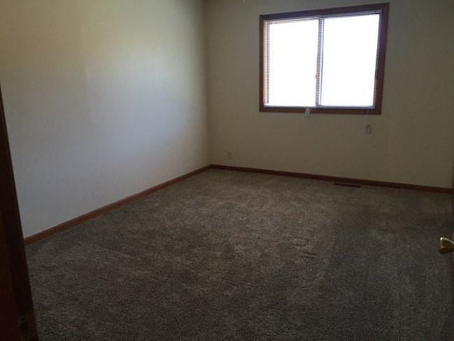 Bedroom with wooden flooring at Dutch Hills Terrace Apartments, Parkersburg, WV